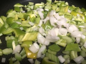 green bell pepper, celery, and onion in skillet