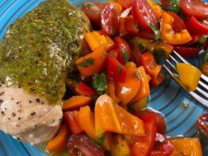 chicken, microgreen chimichurri, tomatoes, and bell peppers