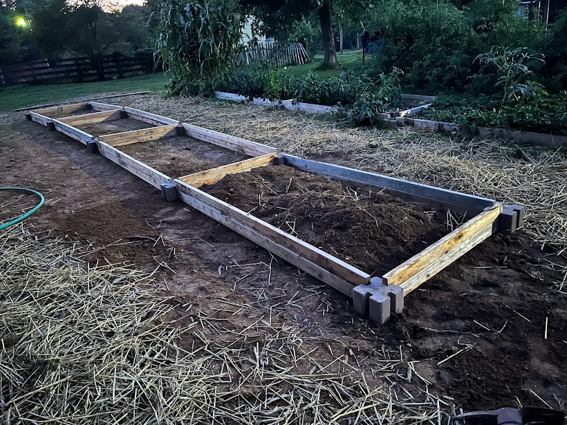 cedar plank and concrete block garden bed