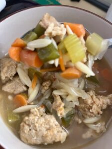 photo of soup made with leftover carrot, celery, cabbage, bell pepper,ground turkey, and orzo pasta 