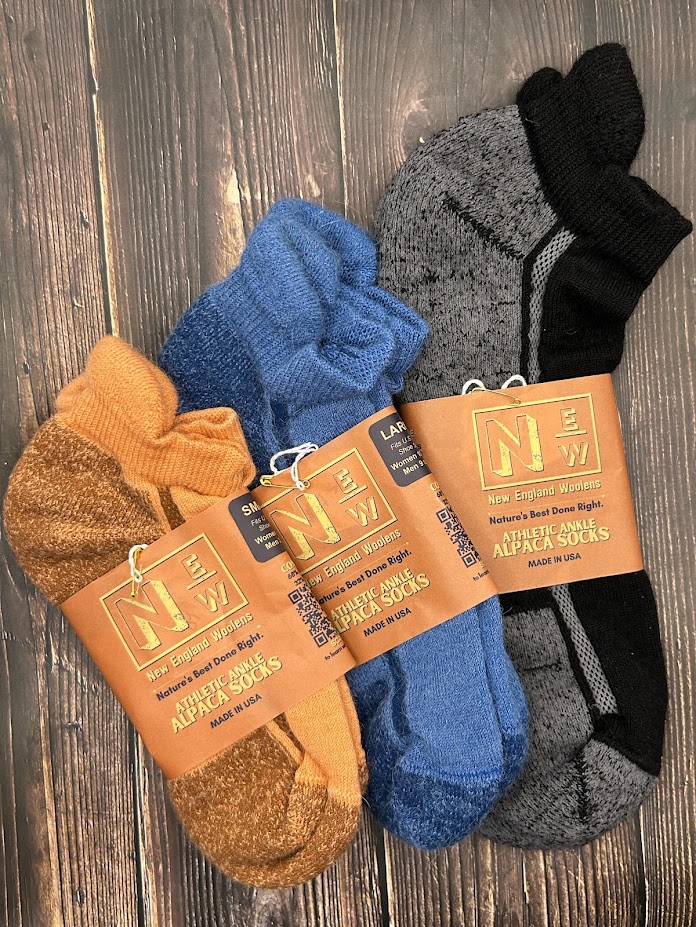 alpaca ankle socks with cushioned sole, reinforced heel, and arch support. Low-profile design with heel tab prevents blisters while providing comfort and durability.