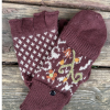 A pair of "vail" alpaca glittens with fleece lining, featuring a convertible mitten flap over fingerless gloves for extra warmth and versatility.